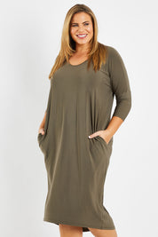 Model Fiona wearing size 16 of The Wanderer In Me Travel Dress in colour Khaki (Green), from the front, cropped image