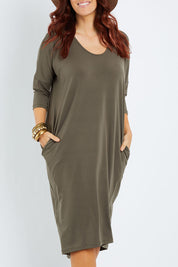 Model Laura wearing size 14 of The Wanderer In Me Travel Dress in colour Khaki (Green), from the front, cropped image