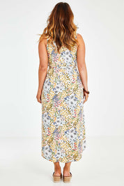 Model Laura wearing size 14 of the Freedom Faux Wrap Dress in colour Fleur, from the back