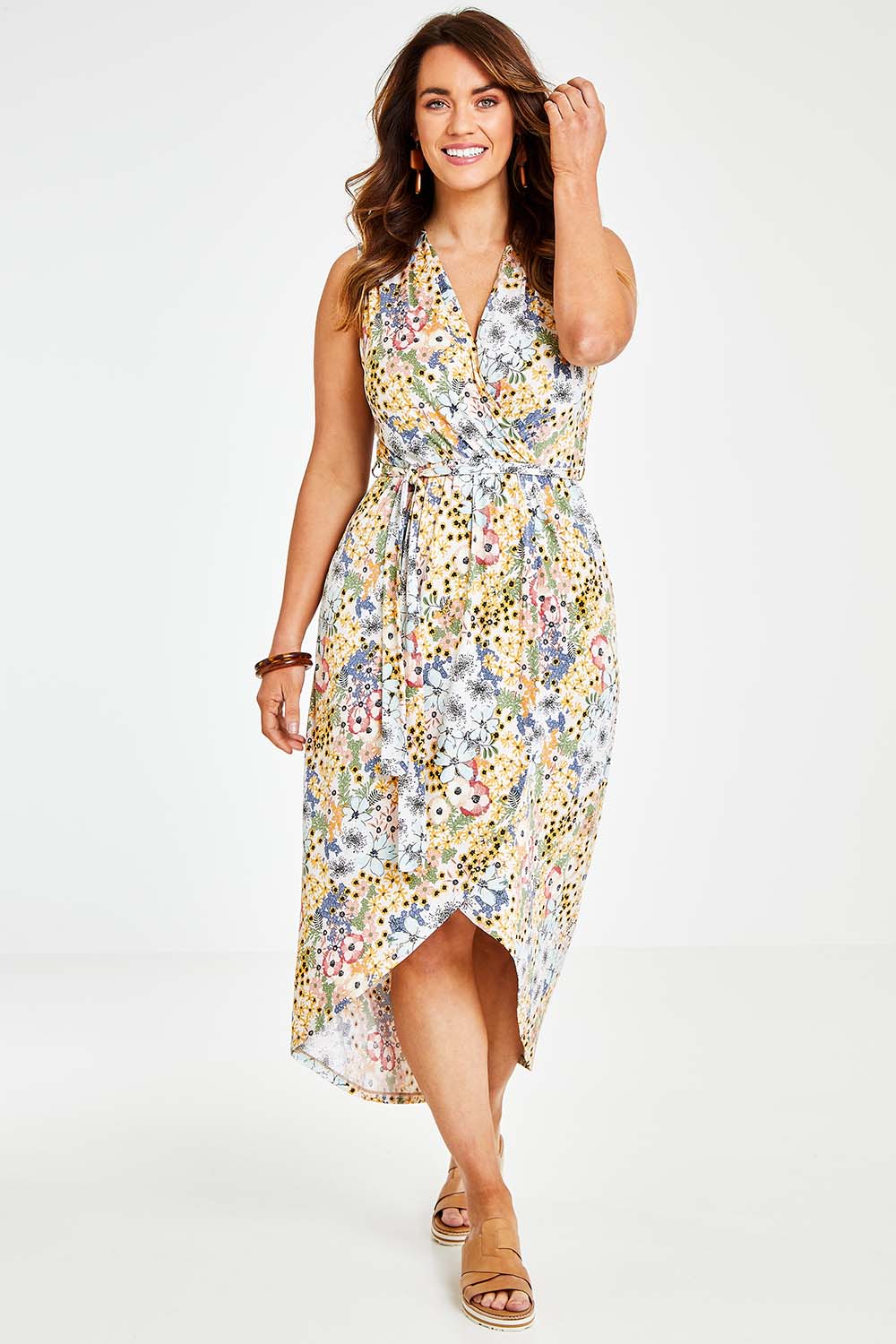 Model Laura wearing size 14 of the Freedom Faux Wrap Dress in colour Fleur, from the front, showing the whole outfit