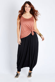 Model Laura wearing size 12 of the Softly Swinging Bamboo Harem Pants in colour Black (Black), from the front, showing the whole outfit