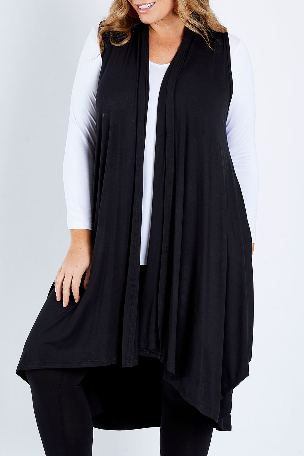Model Fiona wearing size 16 of the Softly Swinging Bamboo Vest in colour Black (Black), from the front, cropped image