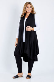 Model Fiona wearing size 16 of the Softly Swinging Bamboo Vest in colour Black (Black), from the front, showing the whole outfit