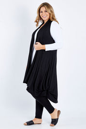 Model Fiona wearing size 16 of the Softly Swinging Bamboo Vest in colour Black (Black), from the front, showing the whole outfit