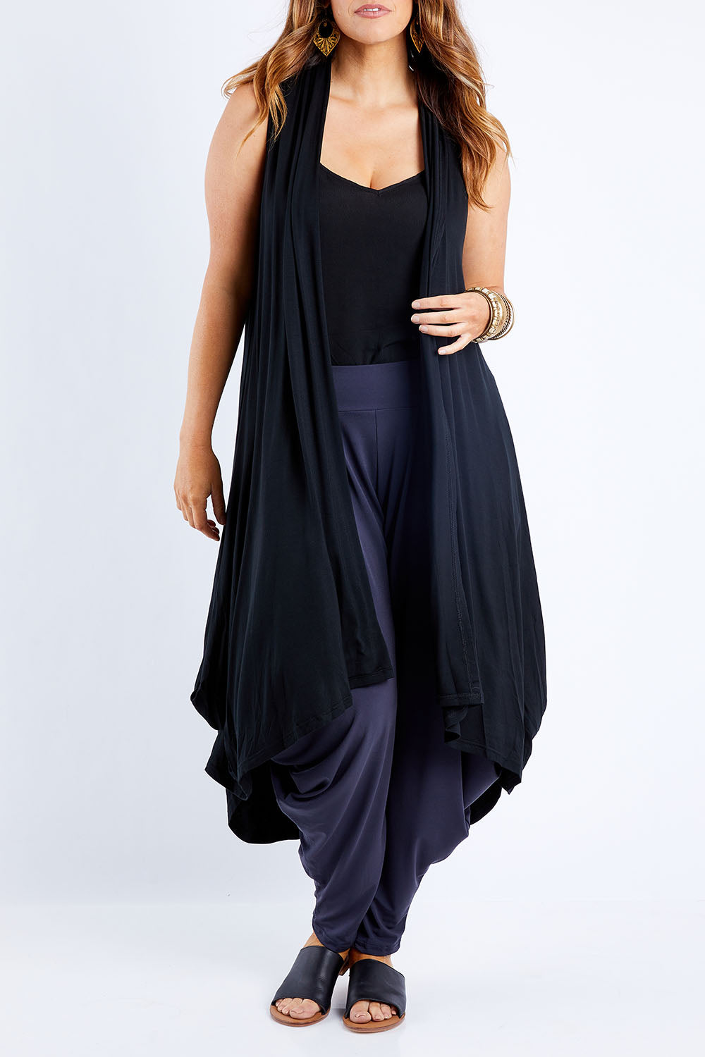 Model Laura wearing size 14 of the Softly Swinging Bamboo Vest in colour Black (Black), from the front, cropped image