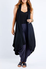 Model Laura wearing size 14 of the Softly Swinging Bamboo Vest in colour Black (Black), from the front, cropped image