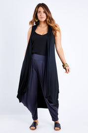 Model Laura wearing size 14 of the Softly Swinging Bamboo Vest in colour Black (Black), from the front, showing the whole outfit