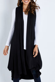 Model Madeline wearing size 10 of the Softly Swinging Bamboo Vest in colour Black (Black), from the front, cropped image