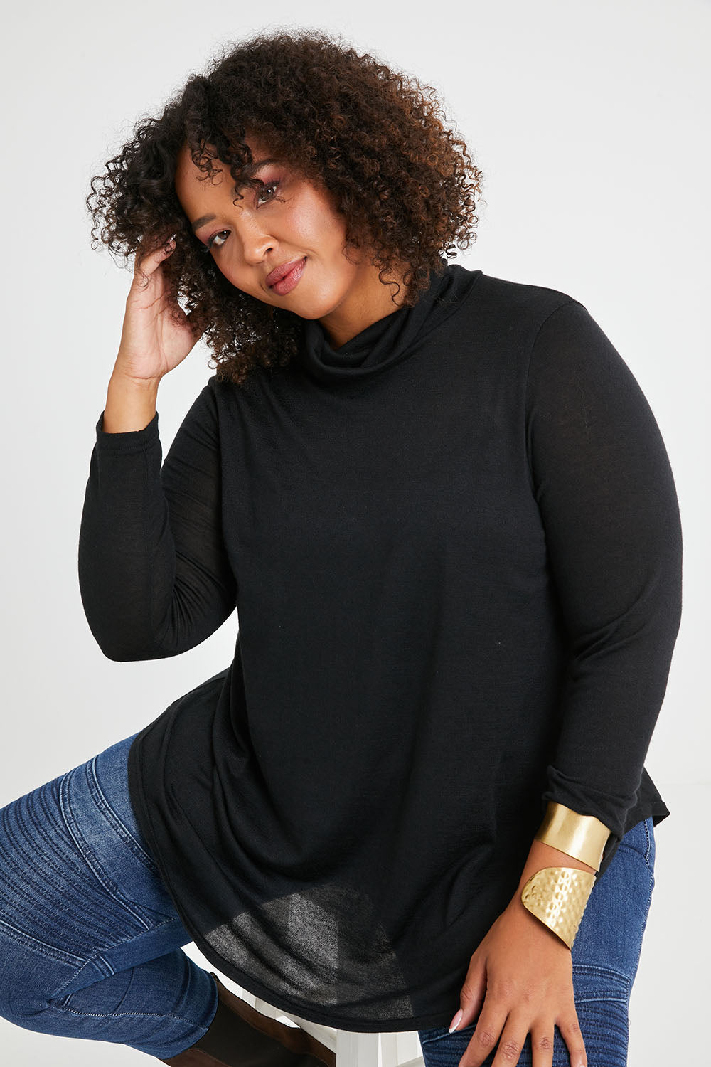 Model Alexis wearing size 16 of the Falling For You Skivvy Tunic in colour Black (Black), from the front, cropped image
