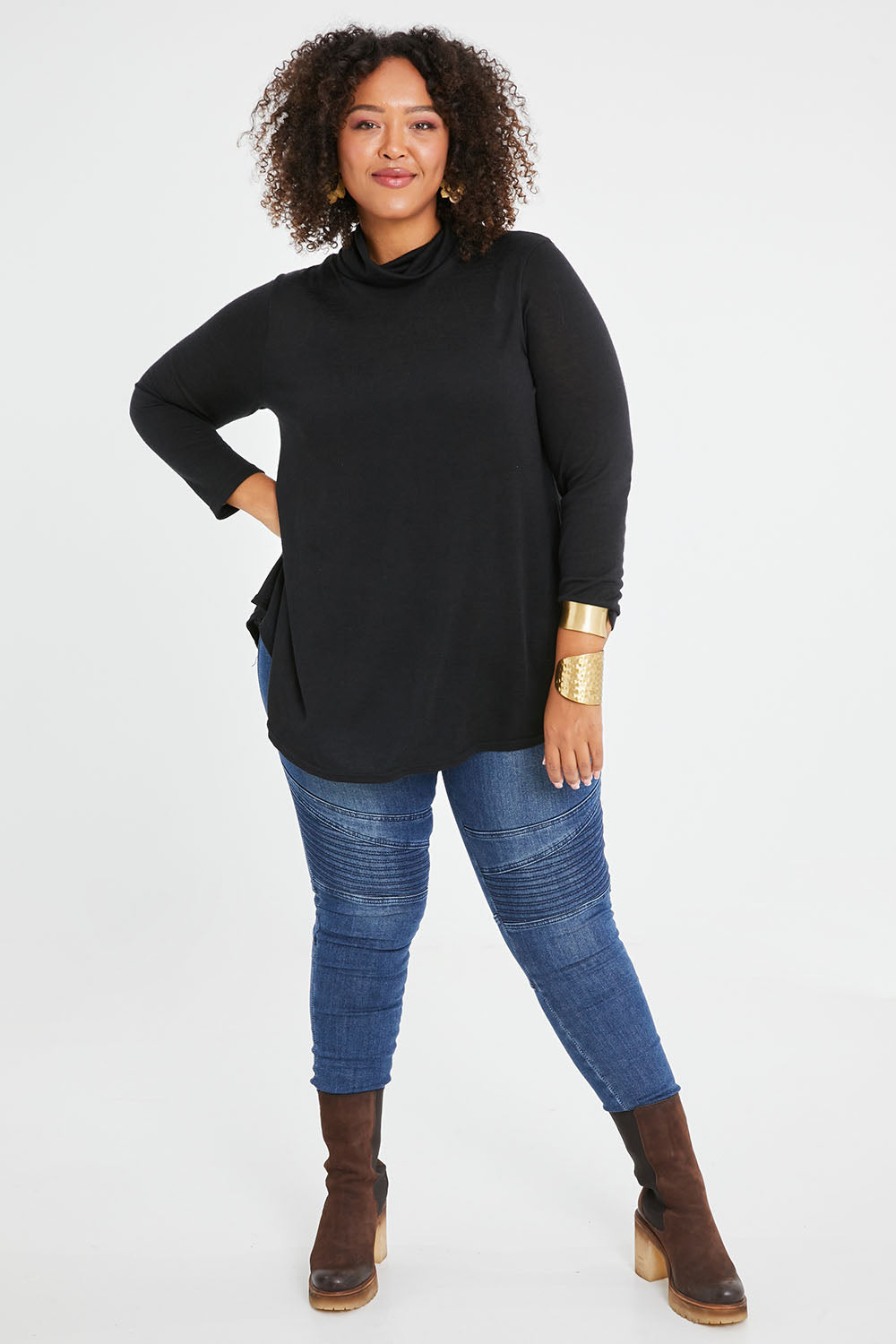 Model Alexis wearing size 16 of the Falling For You Skivvy Tunic in colour Black (Black), from the front, showing the whole outfit