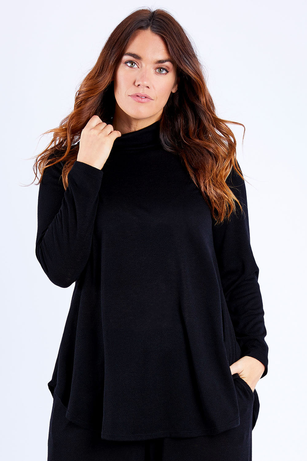 Model Laura wearing size 14 of the Falling For You Skivvy Tunic in colour Black (Black), from the front, cropped image