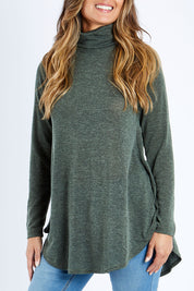 Model Kimberley wearing size 10 of the Falling For You Skivvy Tunic in colour Khaki (Green), from the front, cropped image