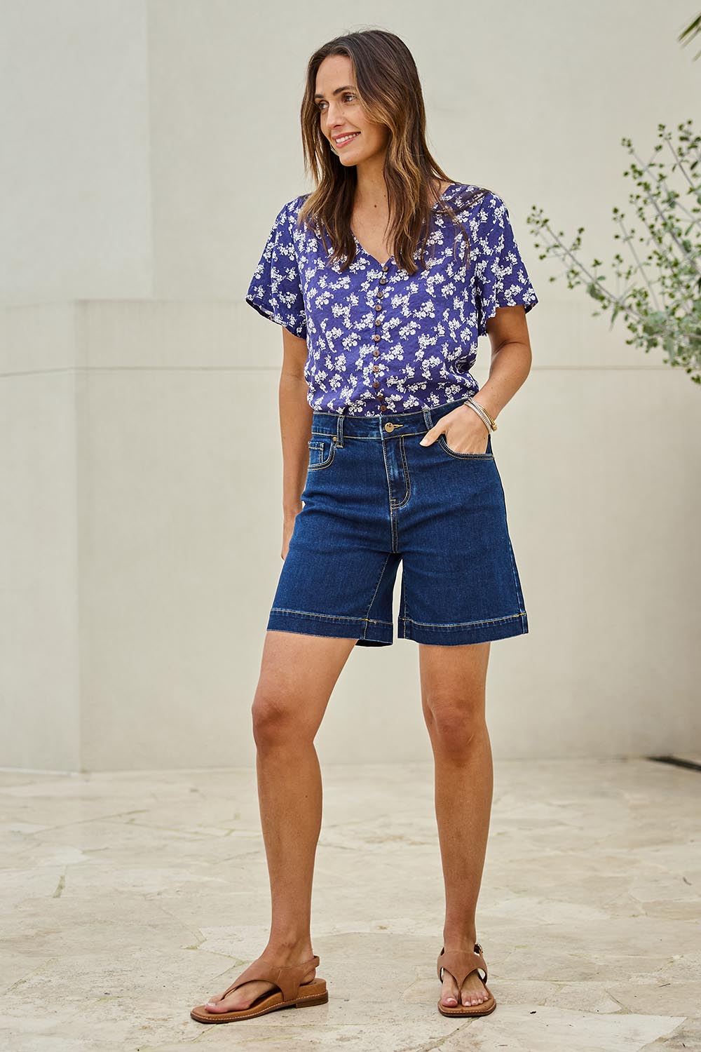 Model Tegand wearing size 10 of the Youre Always There For Me Plain Boyfriend Shorts – Darkdenim in colour Darkdenim, from the front