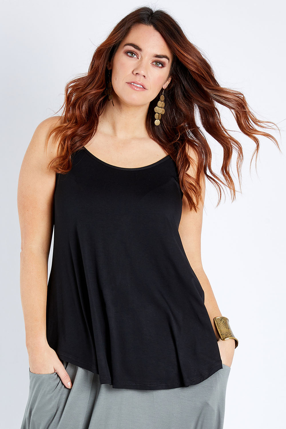 Model Laura wearing size 12 of the Softly Swinging Bamboo Scoop Singlet in colour Black (Black), from the front, cropped image