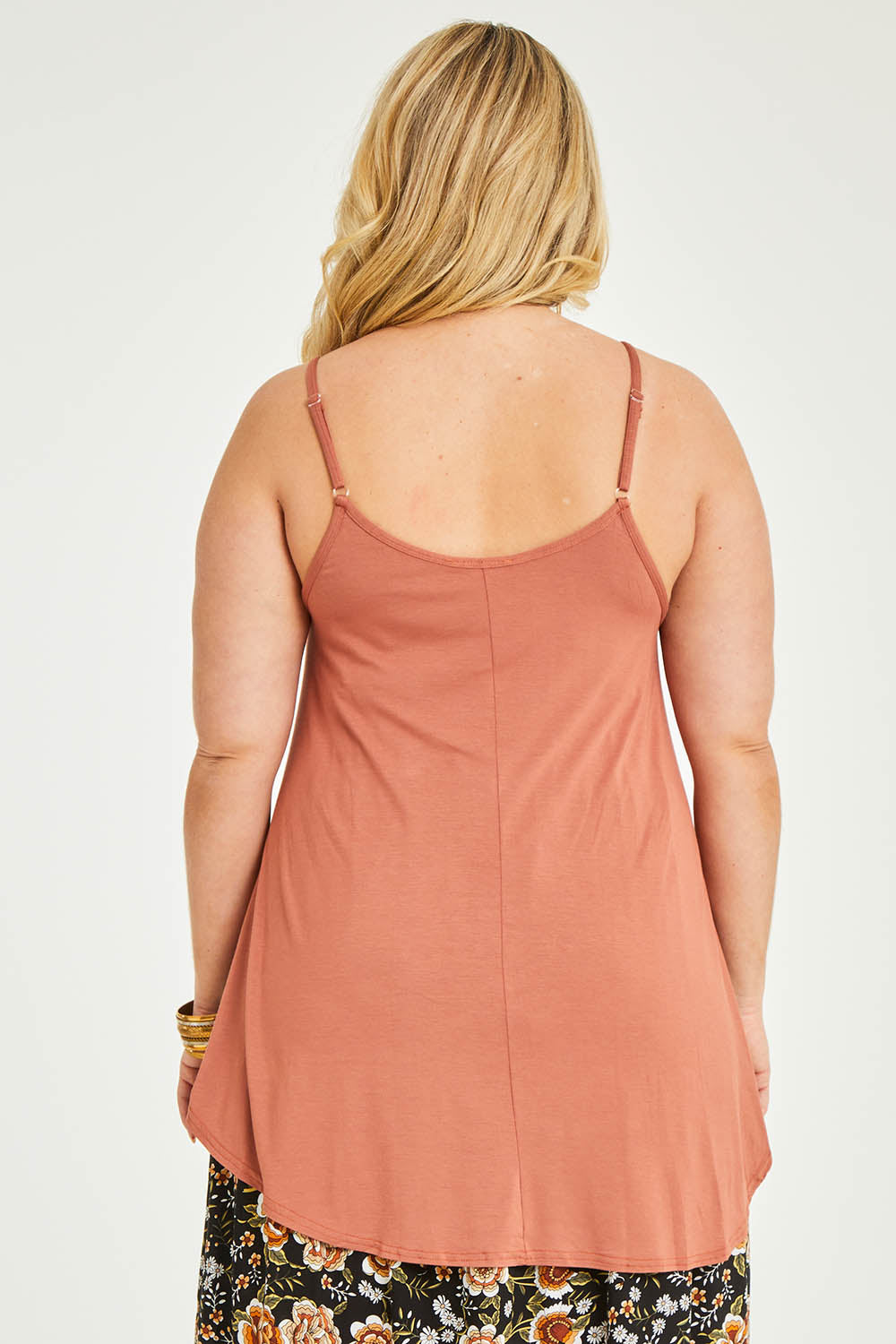 Model Katie wearing size 16 of the Softly Swinging Bamboo Scoop Singlet in colour Copper, from the back