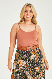 Model Katie wearing size 16 of the Softly Swinging Bamboo Scoop Singlet in colour Copper, from the front, cropped image