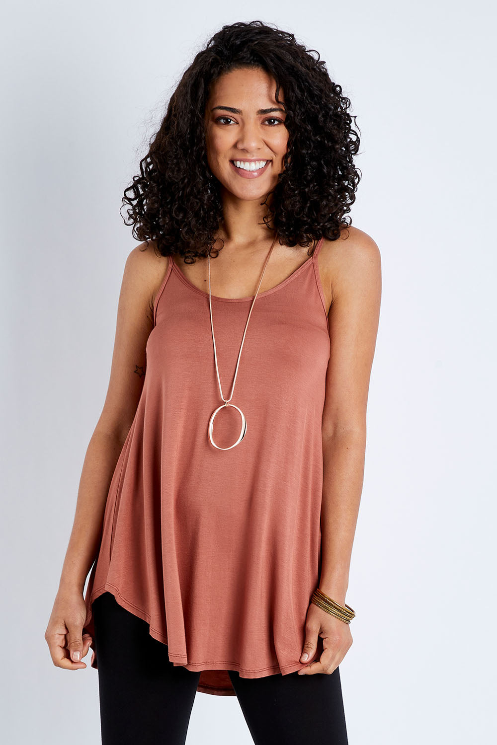Model Pamela wearing size 10 of the Softly Swinging Bamboo Scoop Singlet in colour Copper, from the front, cropped image