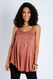 Model Pamela wearing size 10 of the Softly Swinging Bamboo Scoop Singlet in colour Copper, from the front, cropped image