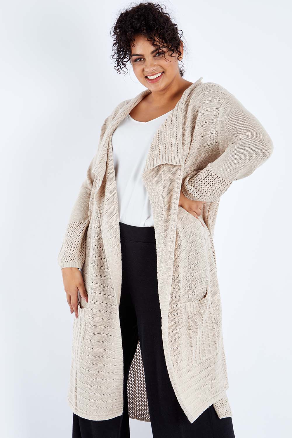 Model Sasha-Lee wearing size XL of the Starlit Night Cotton Cardi in colour Latte, from the front, cropped image