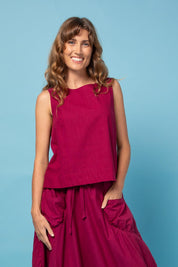 A model wearing the Hara Cotton Top in colour Magenta (Purple), from the front, showing the whole outfit