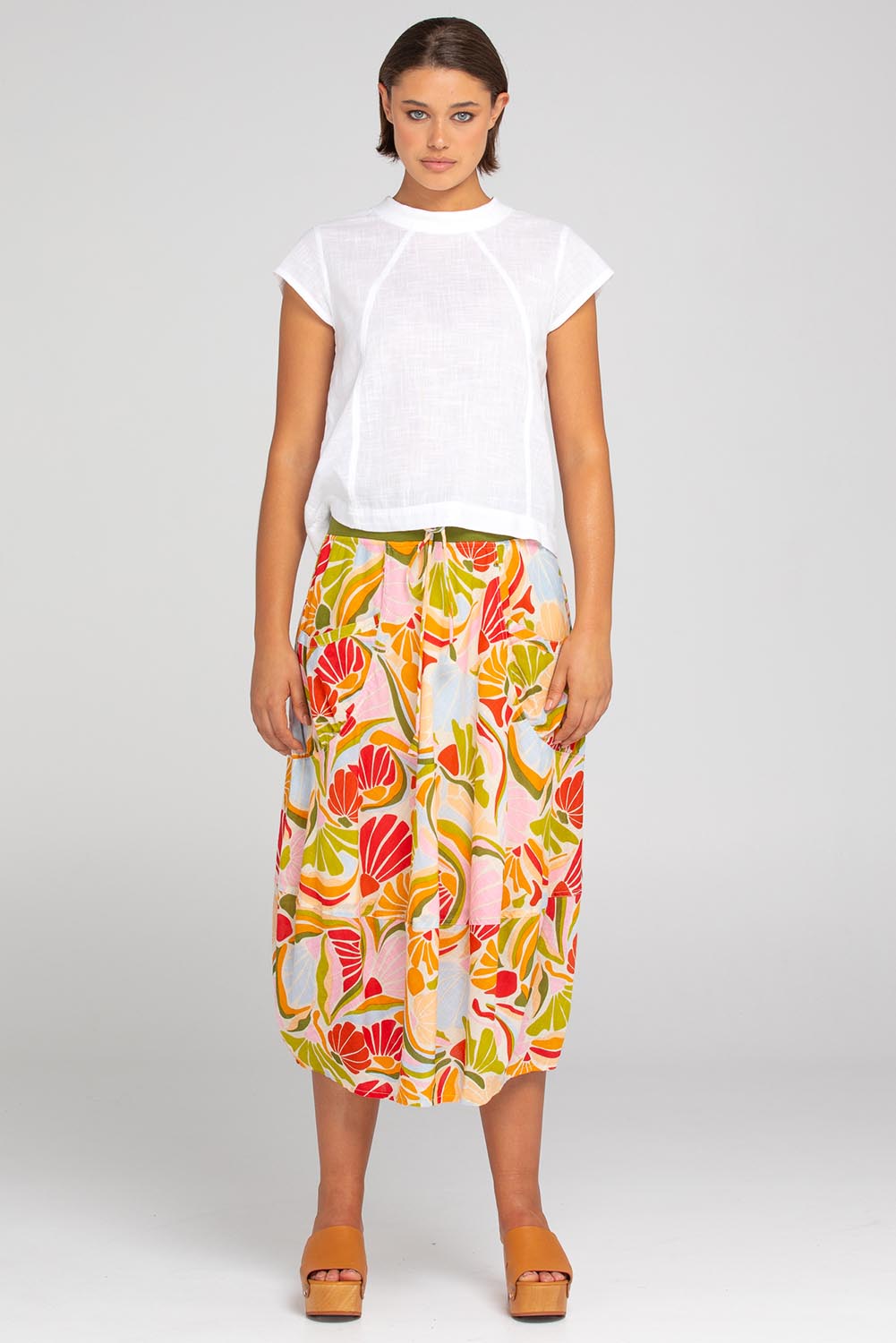 A model wearing the Leaf Cotton Top in colour White (White), from the front, showing the whole outfit