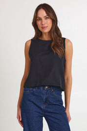 Model Madeline wearing size 10 of the Rose Linen Top in colour Black (Black), from the front, cropped image