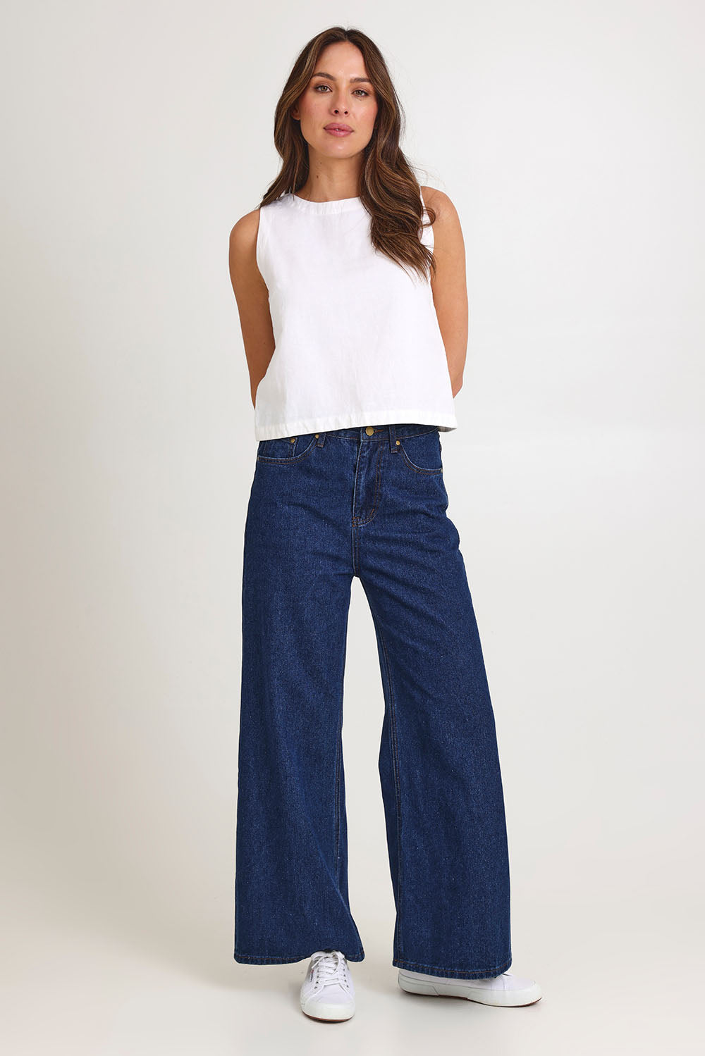 Model Madeline wearing size 10 of the Rose Linen Top in colour White (White), from the front, showing the whole outfit