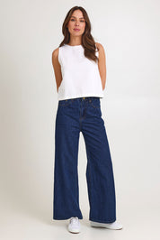 Model Madeline wearing size 10 of the Rose Linen Top in colour White (White), from the front, showing the whole outfit