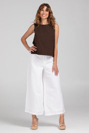 A model wearing the Jedda Linen Cotton Pant in colour White (White), from the front, showing the whole outfit