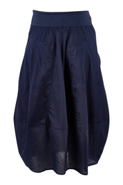 Product shot of the Guru Skirt in colour Navy (Blue), from the back