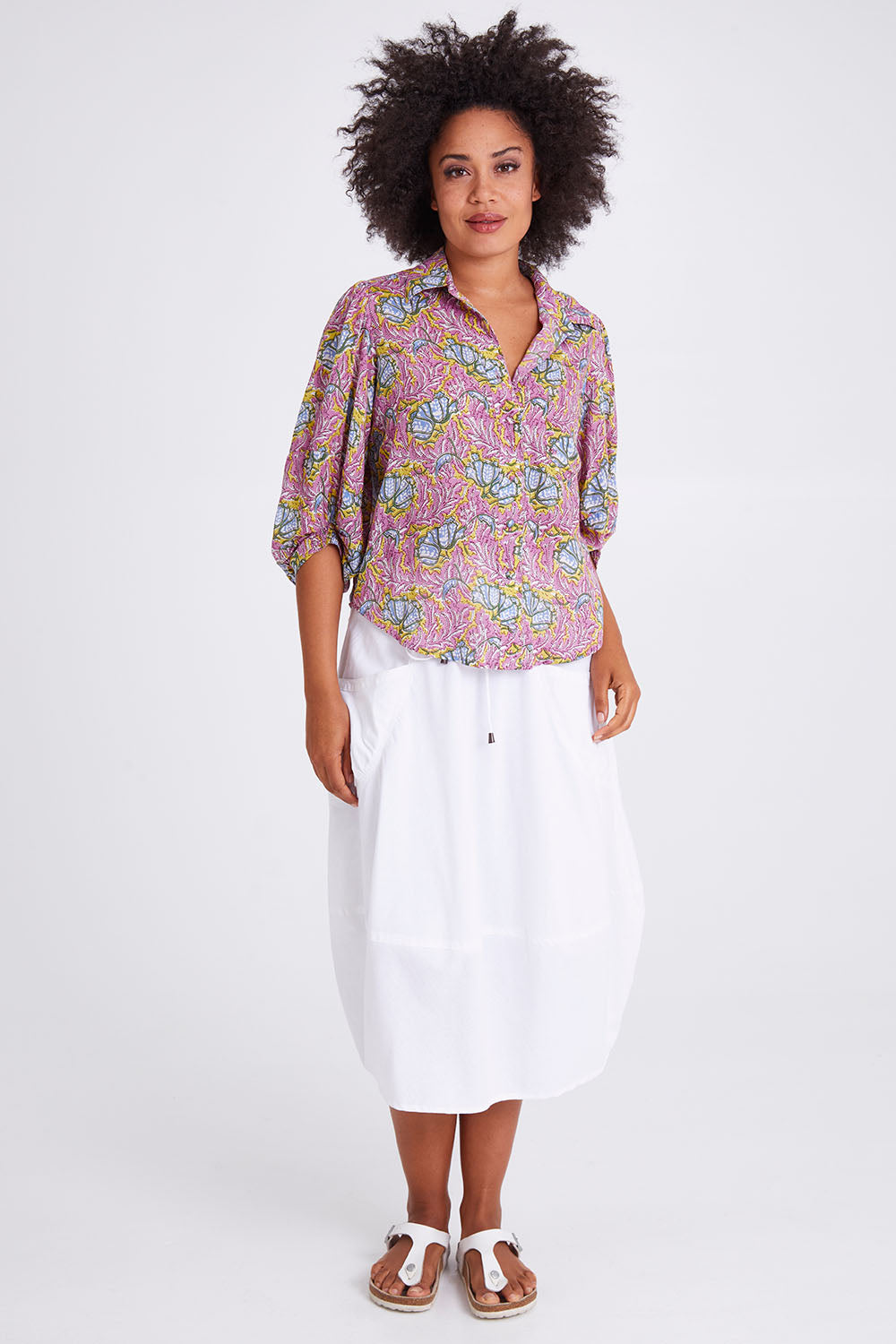 Model Olivia wearing size 10 of the Guru Skirt in colour White (White), from the front, showing the whole outfit