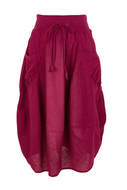 Product shot of the Guru Cotton Skirt in colour Magenta (Purple), from the front