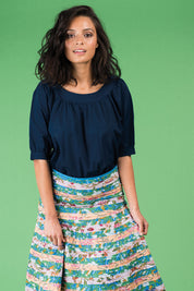 A model wearing the Bliss Top Basics in colour BlueBasic (Blue), from the front, cropped image