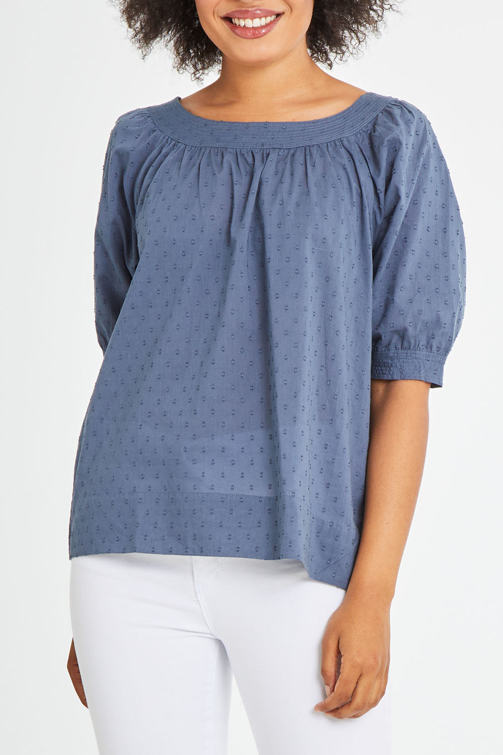 Model Olivia wearing size 10 of the Bliss Top in colour Indiansea (Blue), from the front, cropped image