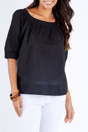 Model Vitoria wearing size 10 of the Bliss Top in colour Black (Black), from the front, cropped image