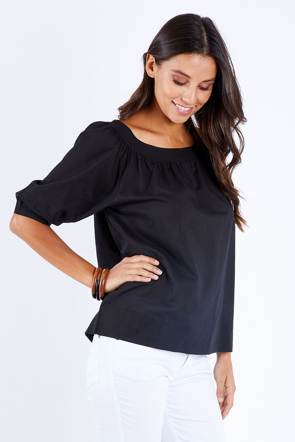 Model Vitoria wearing size 10 of the Bliss Top in colour Black (Black), from the front, cropped image