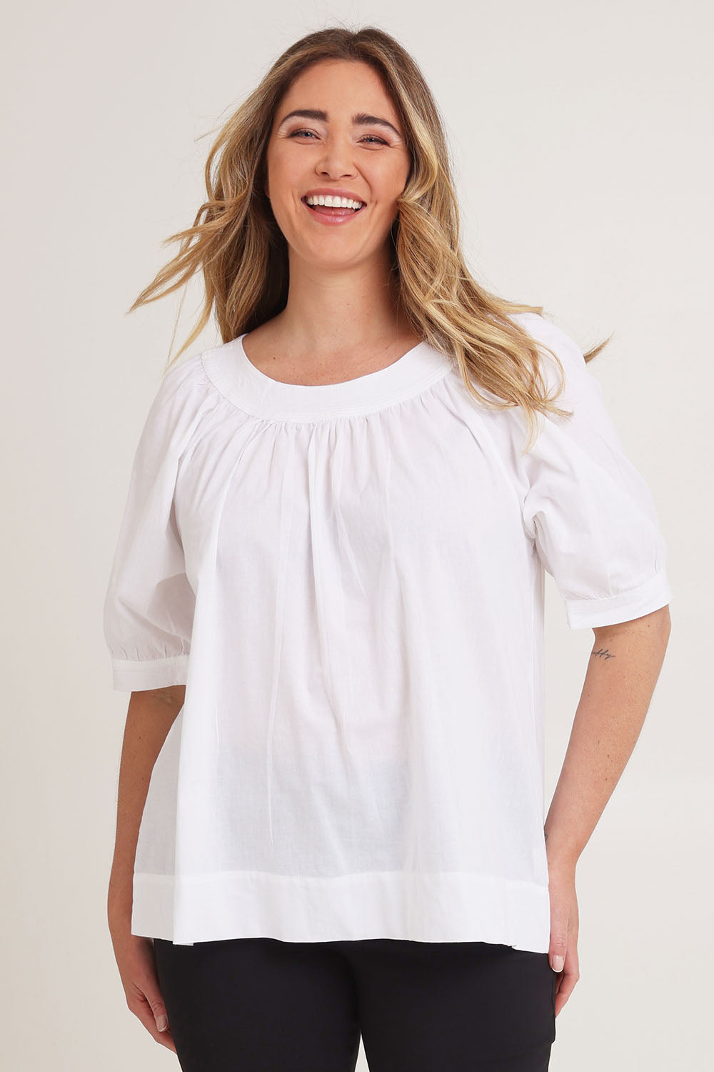 Model Chanel wearing size 16 of the Bliss Top in colour White (White), from the front, cropped image
