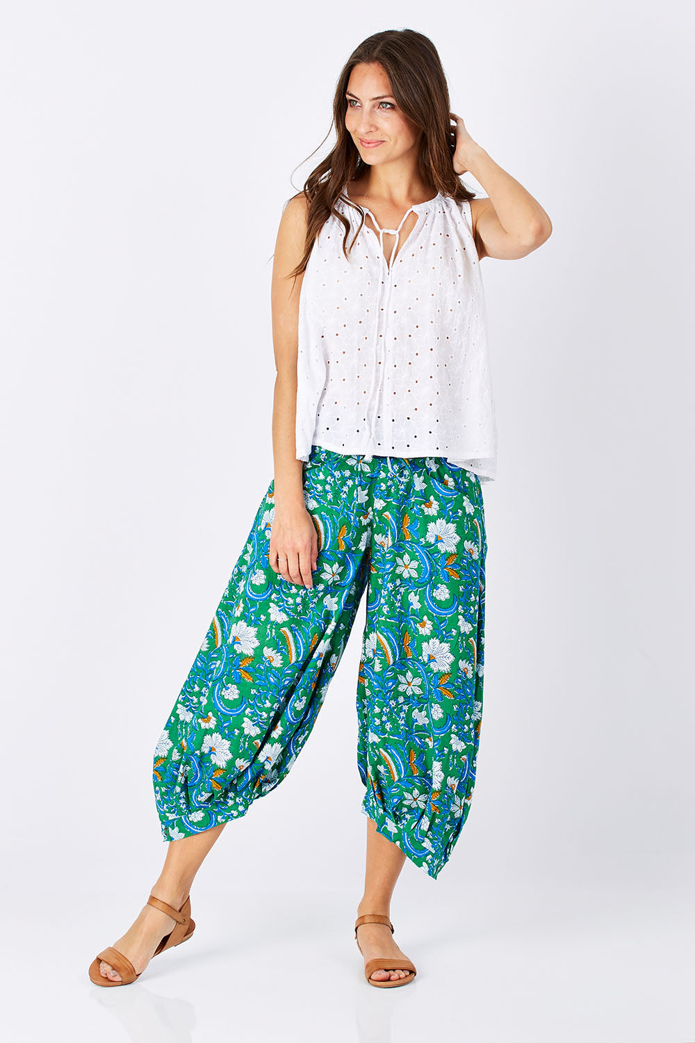 Model Anna wearing size 10 of the Printed Guru Pants in colour BlockGreen (Green), from the front, showing the whole outfit