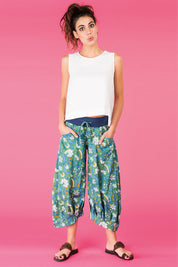 A model wearing the Printed Guru Pants in colour BlockGreen (Green), from the front, showing the whole outfit