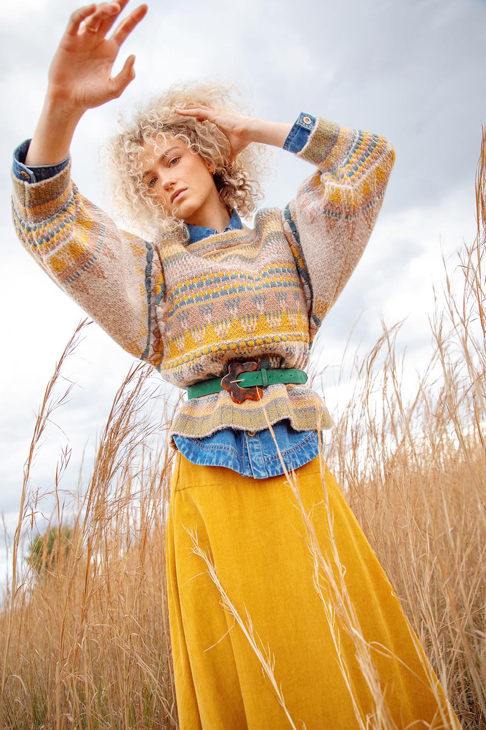 A model wearing the Flower Suede Belt in colour Peacock (Blue), from the front, showing the whole outfit