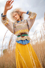 A model wearing the Flower Suede Belt in colour Peacock (Blue), from the front, showing the whole outfit