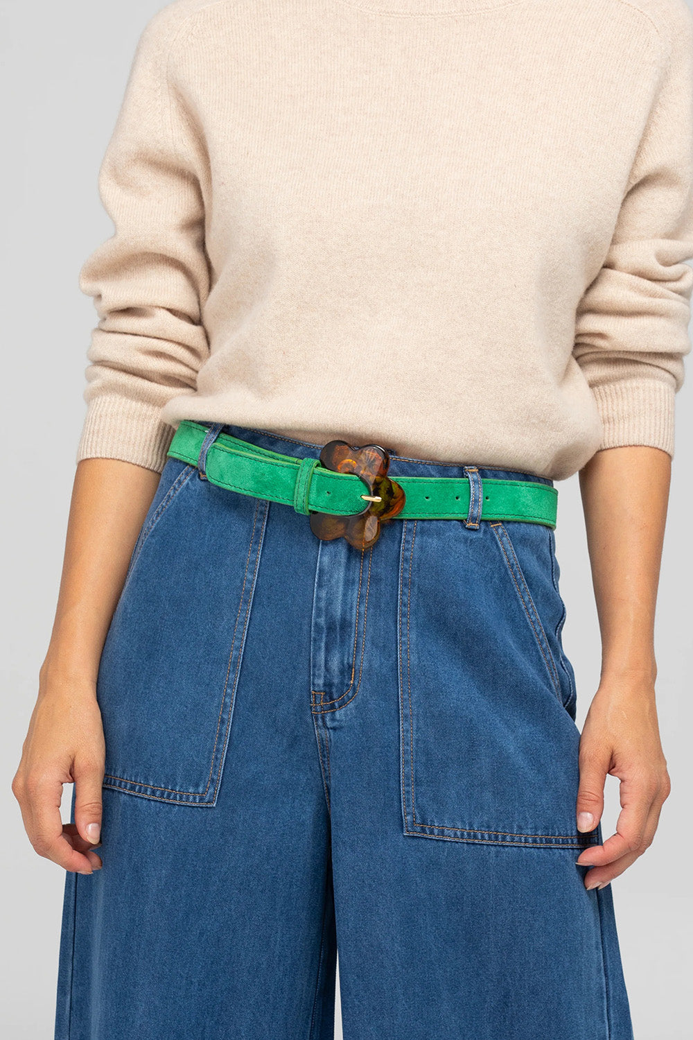 A model wearing the Flower Suede Belt in colour Peacock (Blue), from the front, showing the whole outfit