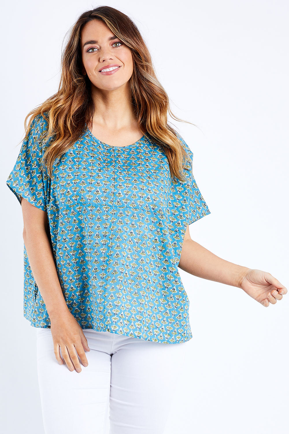 Model Laura wearing size 14 of the Alora Top in colour Bananaflow (Blue), from the front, cropped image