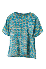 Product shot of the Alora Top in colour Bananaflow (Blue), from the front