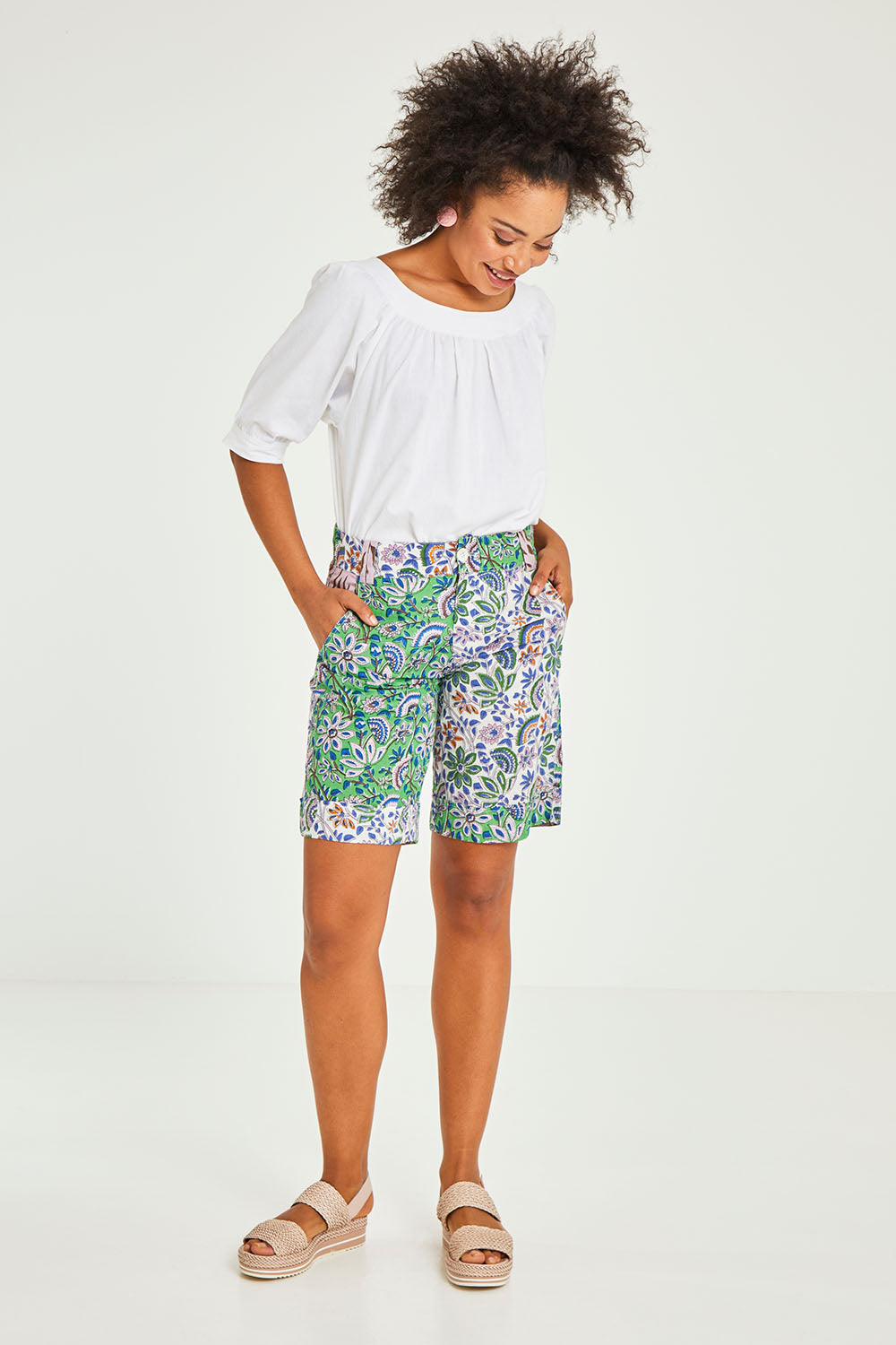 Model Olivia wearing size 10 of the Tone Patch Short in colour Endora (Green), from the front, showing the whole outfit