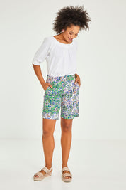 Model Olivia wearing size 10 of the Tone Patch Short in colour Endora (Green), from the front, showing the whole outfit