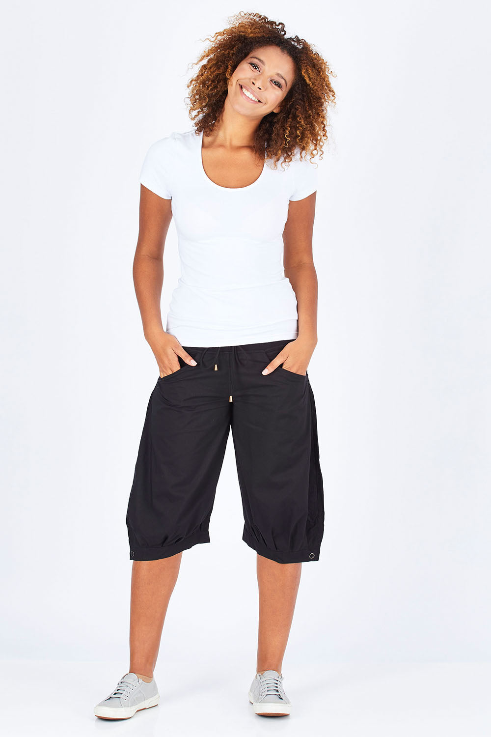 Model Summer wearing size 10 of the Jada Short in colour Black (Black), from the front, showing the whole outfit