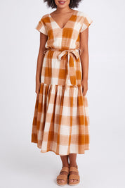 Model Olivia wearing size 10 of the Indy Dress in colour Gingerchec, from the front, cropped image
