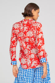 A model wearing the Cove Cotton Shirt in colour Farrah (Red), from the back
