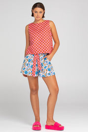 A model wearing the Daisy Cotton Short in colour Splicemaui (Blue), from the front, showing the whole outfit